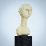 Modernist bust sculpture of a woman in sandstone