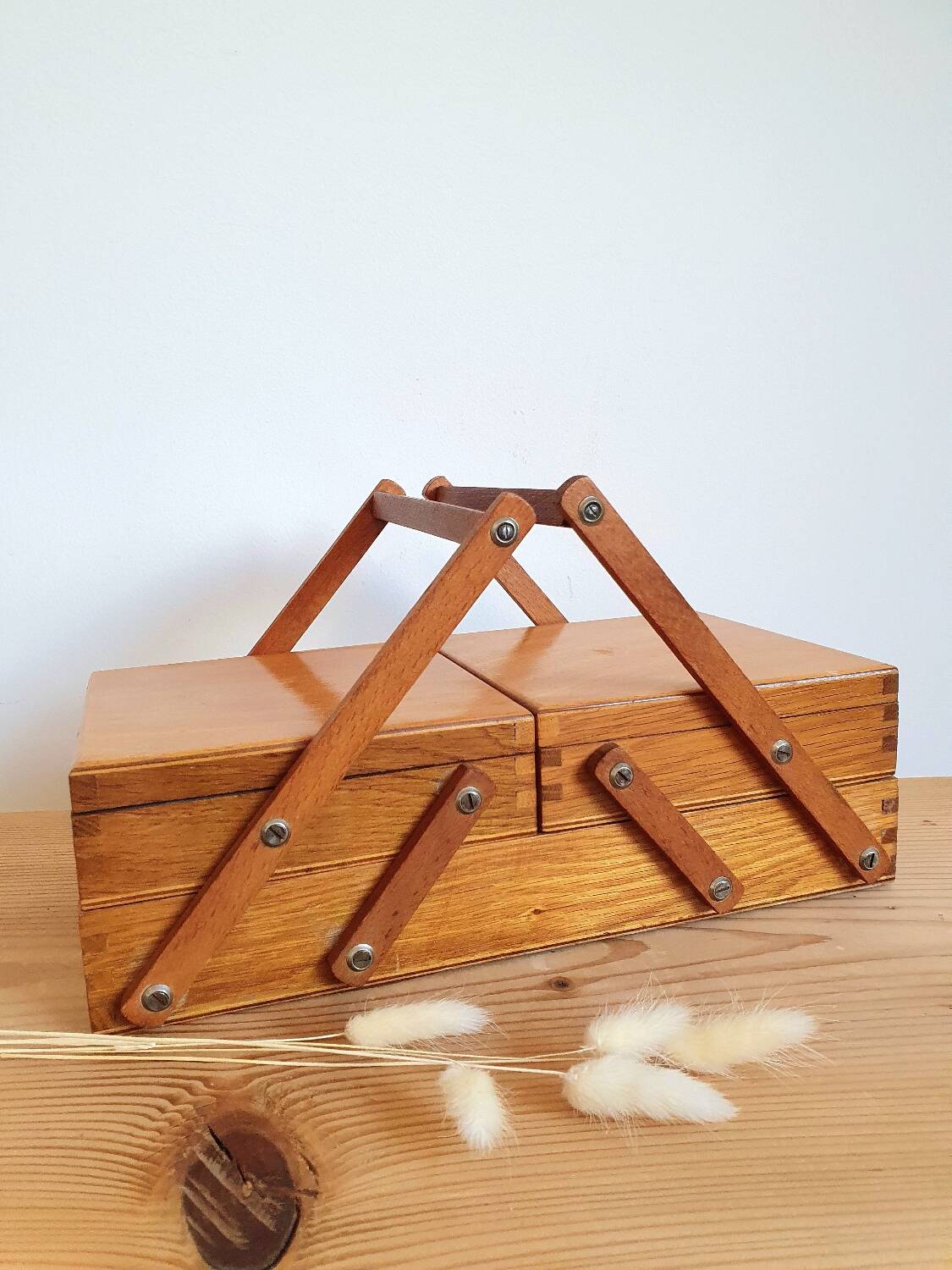 Small wooden sewing worker