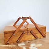 Small wooden sewing worker