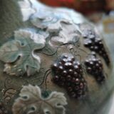 Pitcher decorated with bunches of grapes