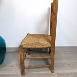 Vintage wooden and straw children's chair in a country style.