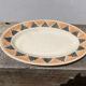 Sun yellow oval ceramic dish Badonviller model Etoile