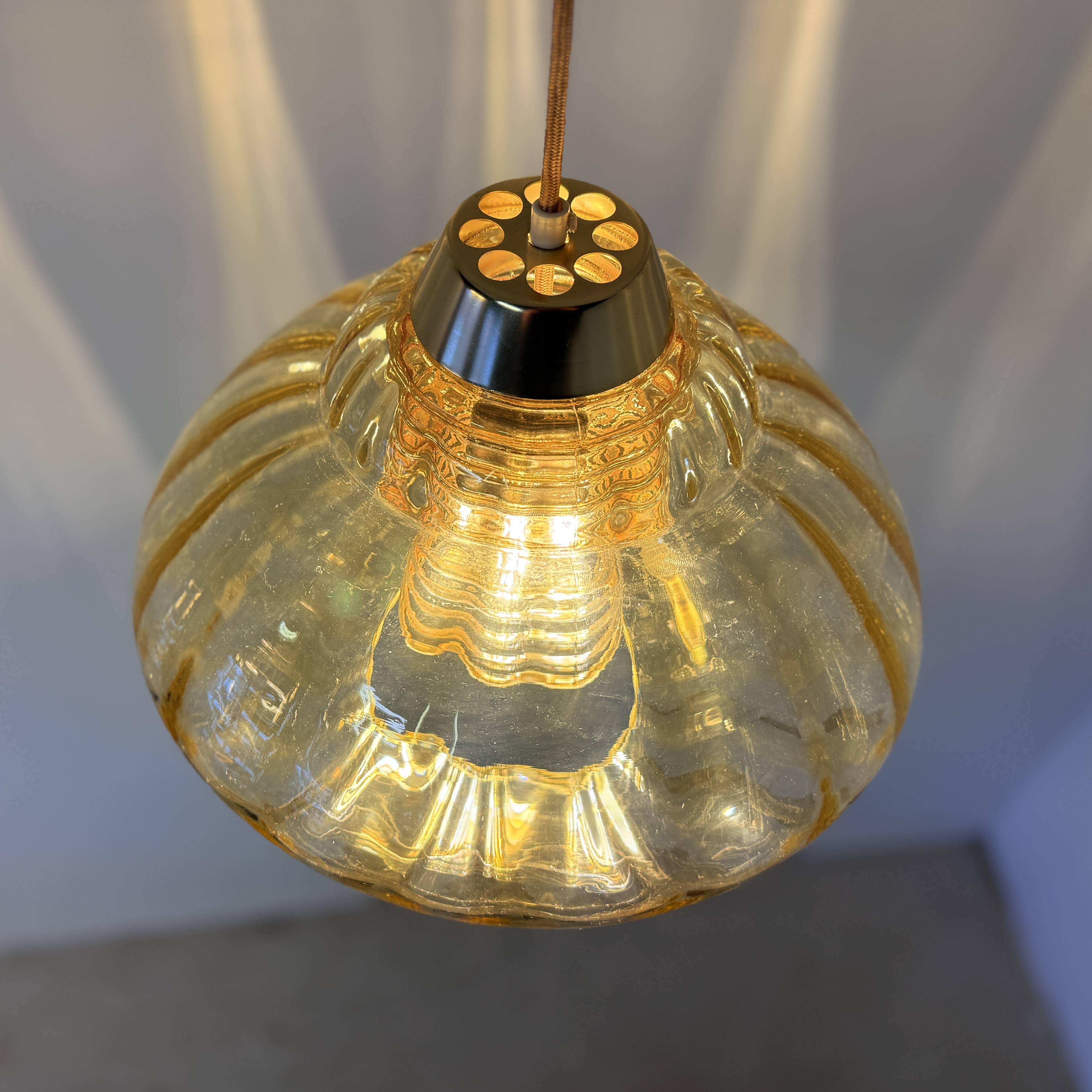 Vintage pendant lamp with amber glass shade