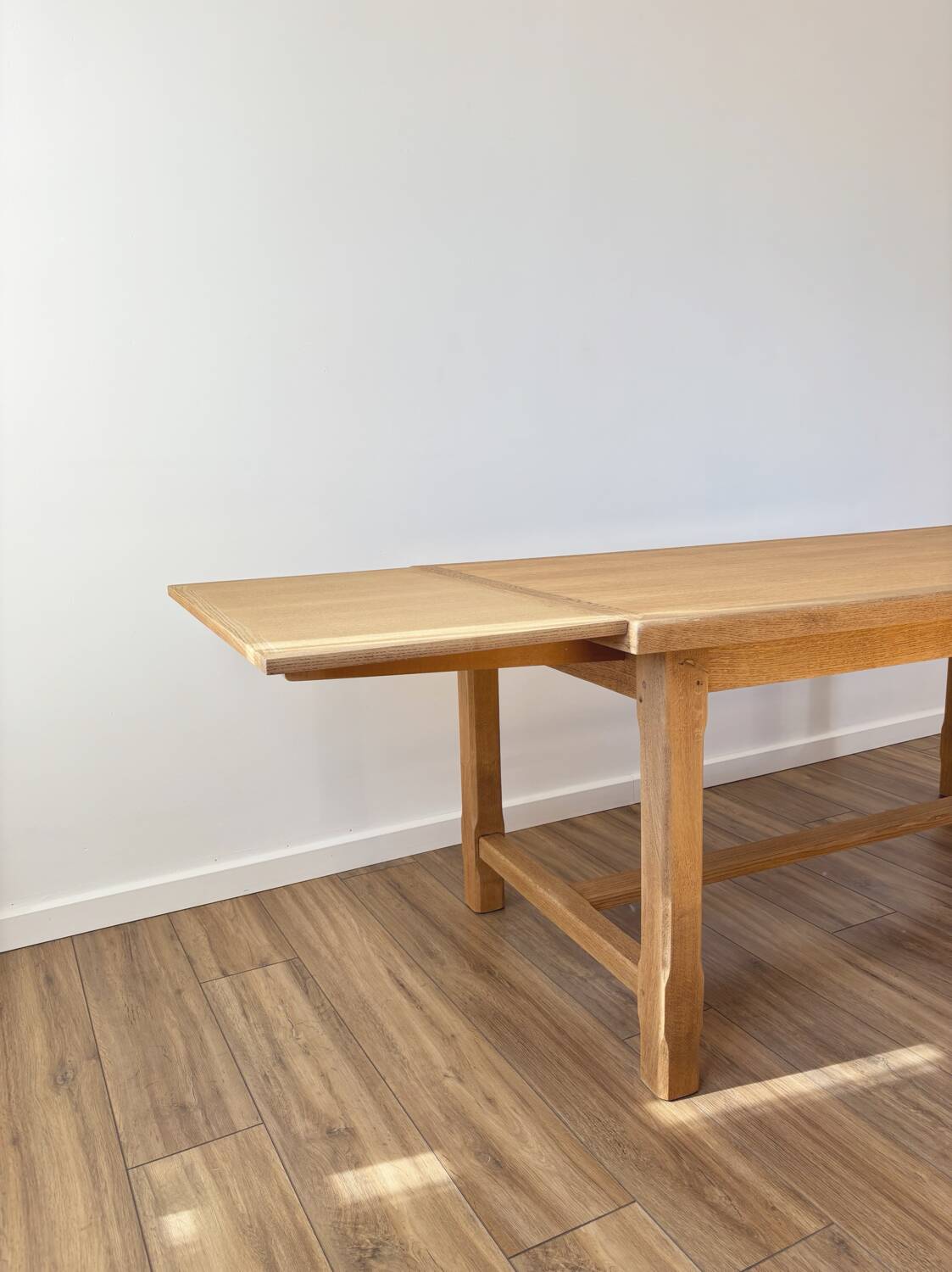 Solid oak farmhouse table with extensions.