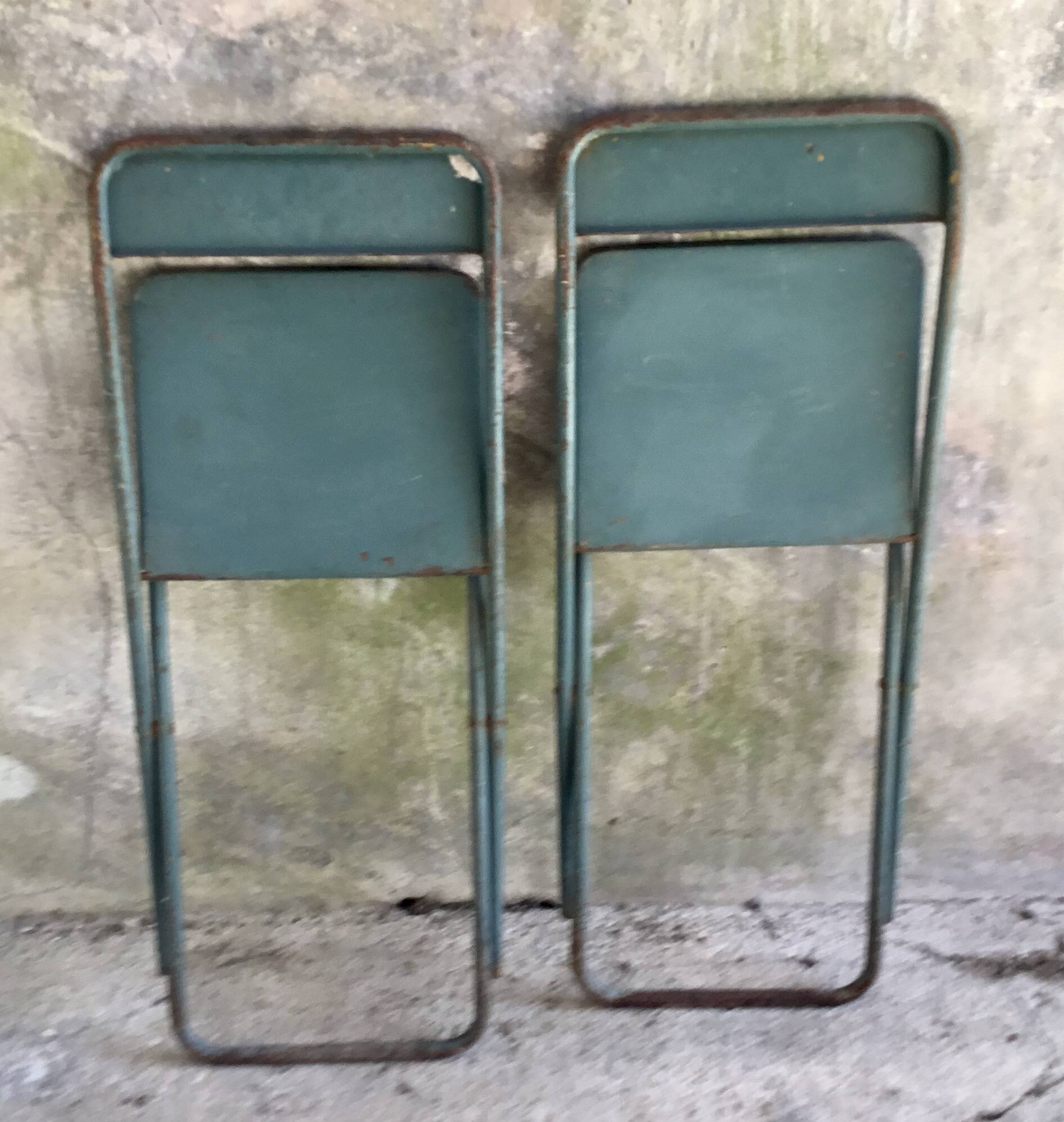 Pair of folding metal chairs, military or industrial, mid-20th century.