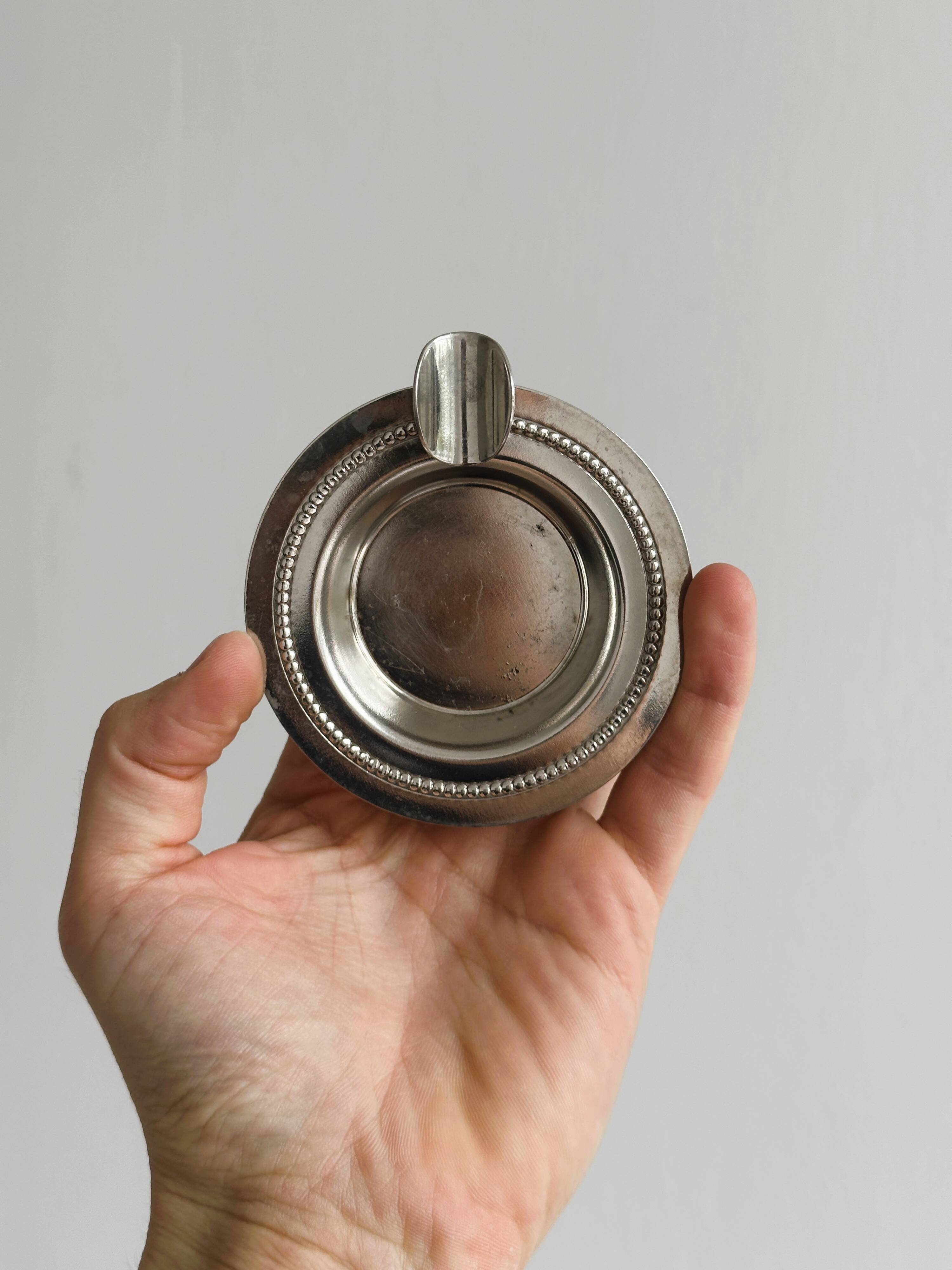 Small ashtray in shiny silver metal