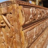Compact 4-drawer ethnic chest of drawers carved with scenes of African life