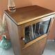 Vintage wooden furniture, vinyl storage, bookshelf, desk.