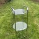 Pedestal table, vintage chrome steel saddle with 2 round windows