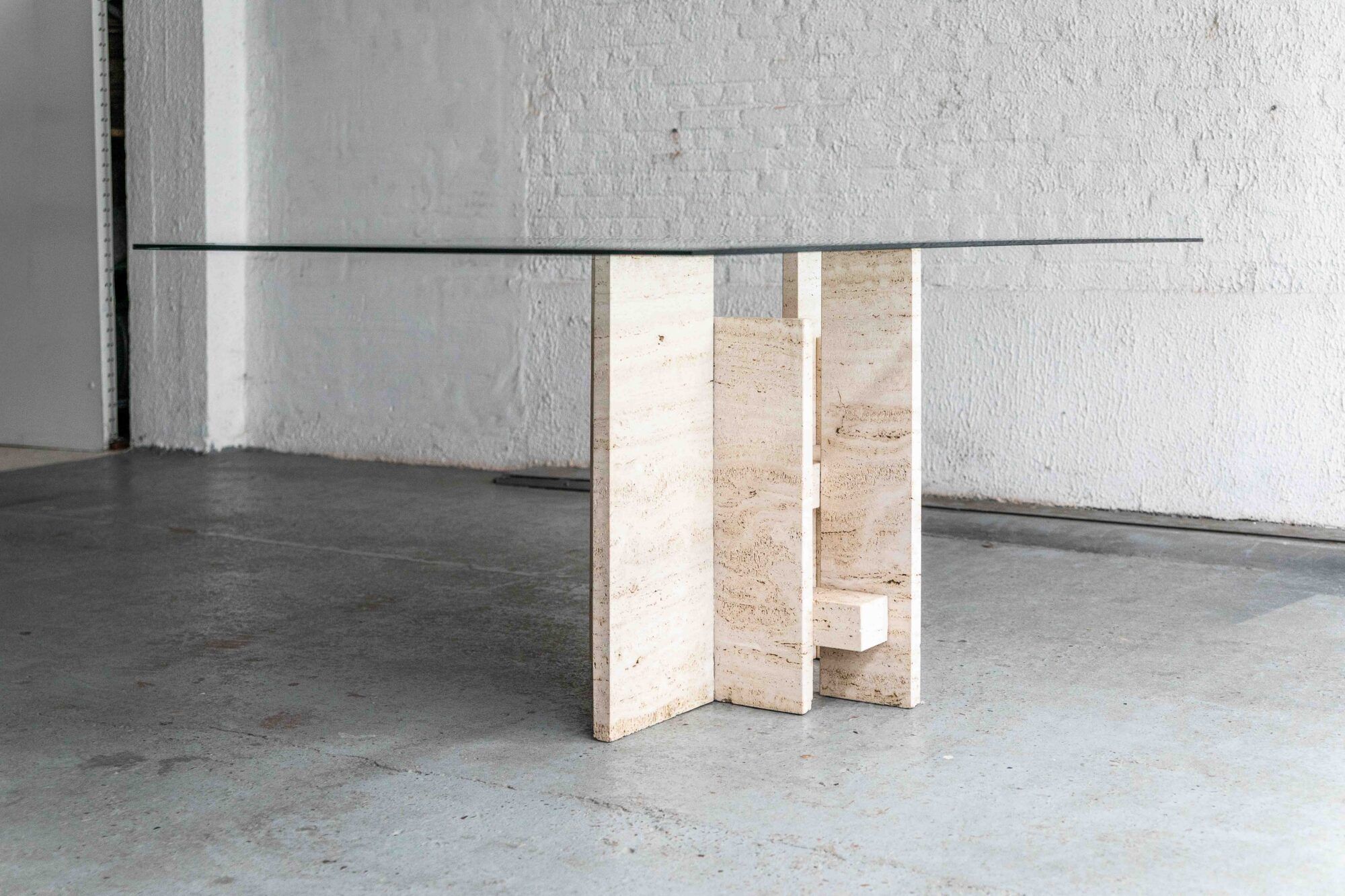 Glass & travertine dining table by Willy Ballez