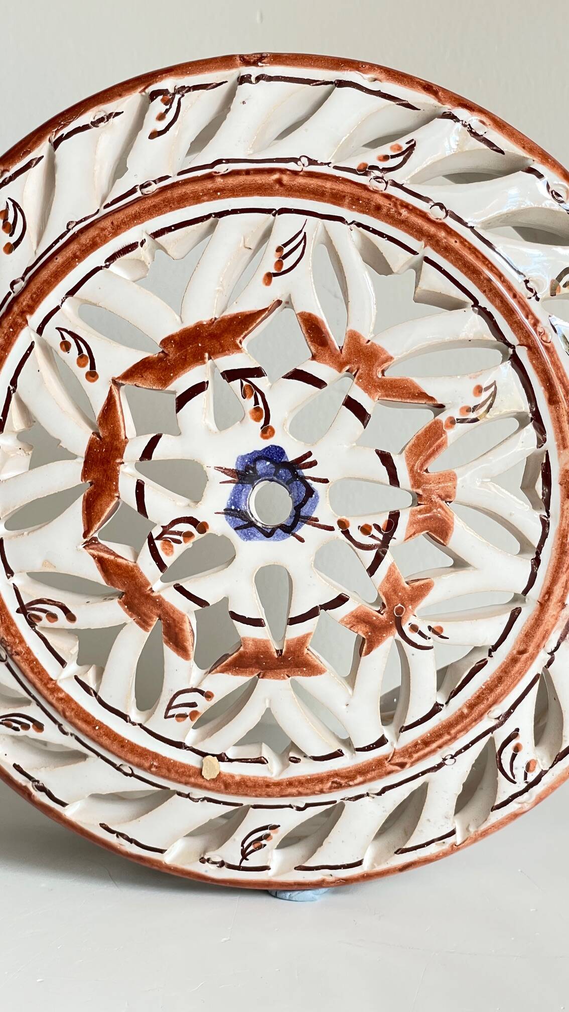 Handmade terracotta wall lamp with blue enamelled center