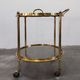 Hollywood Regency bar cart in bronze and smoked glass, 1950s