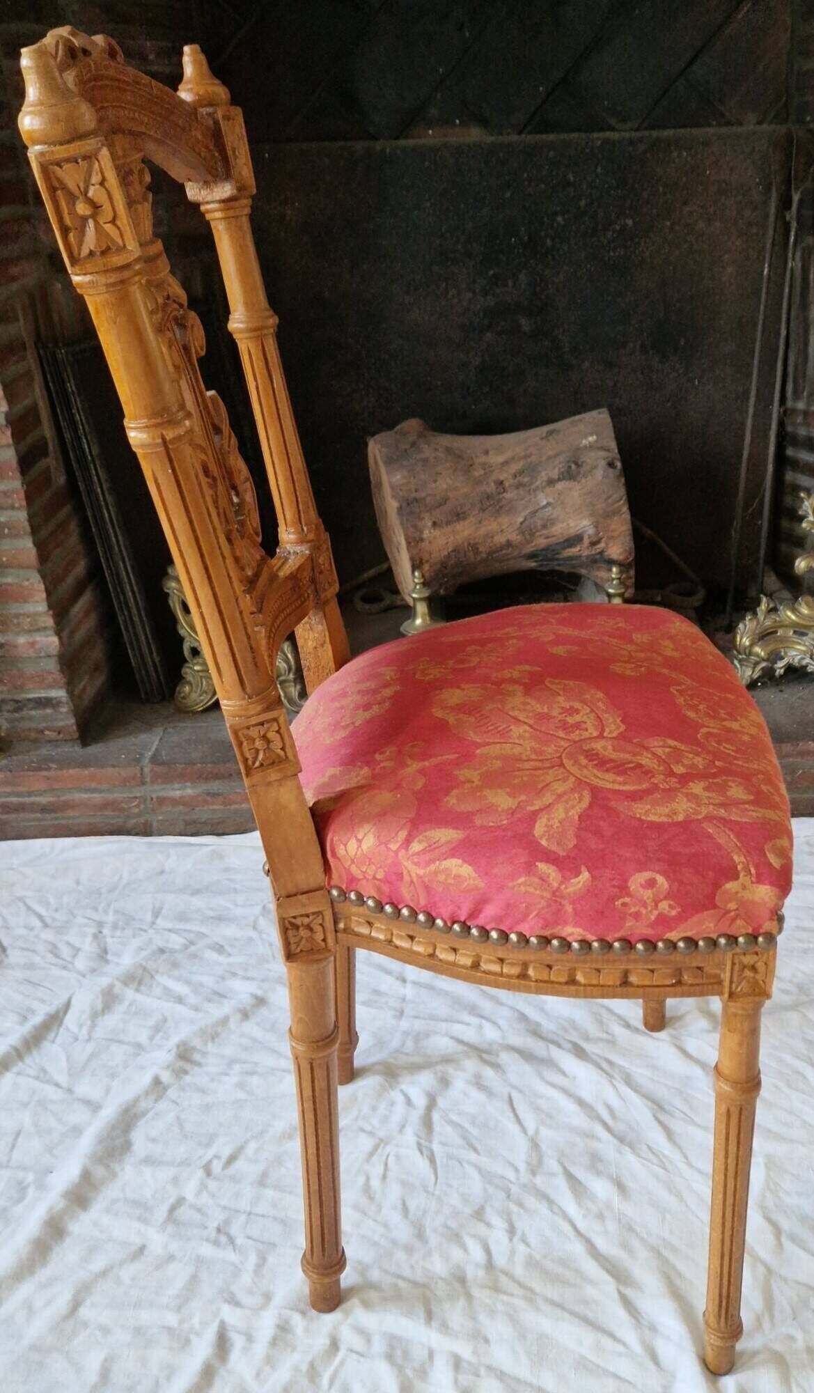 Lyre back chair in carved wood, Louis XVI style, late 19th century.