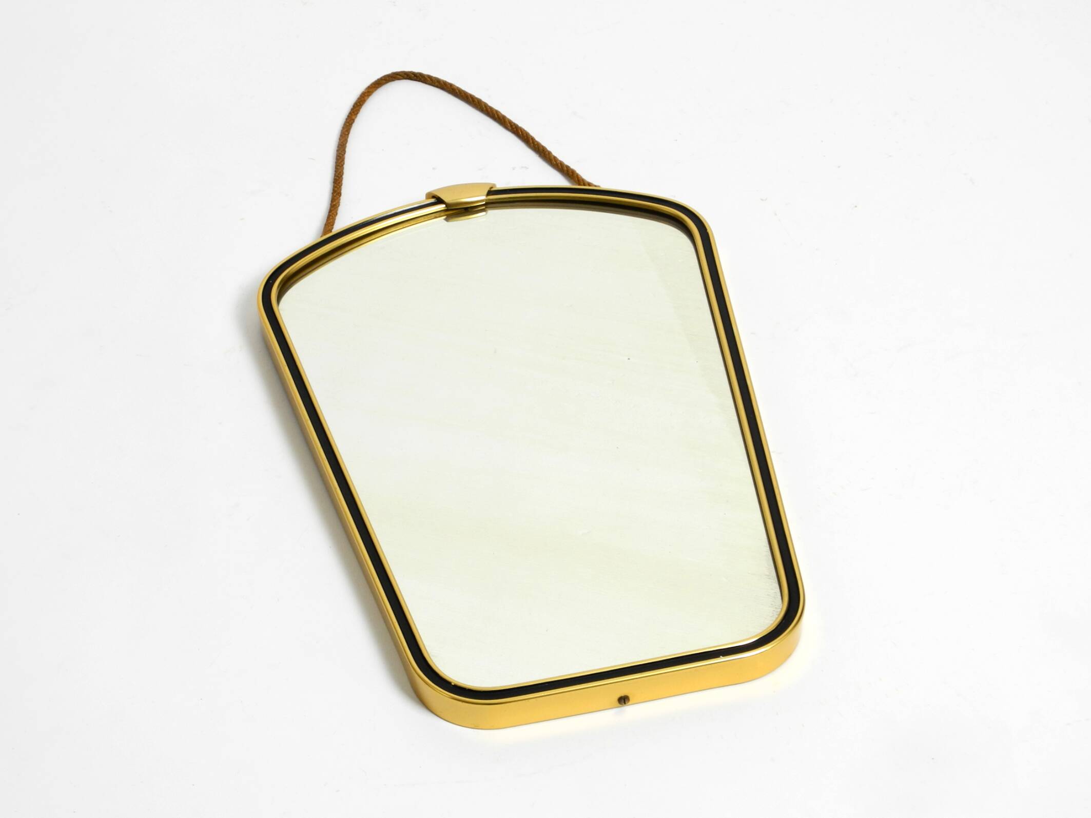 Beautiful small mid-century brass wall mirror with braided hanging strap