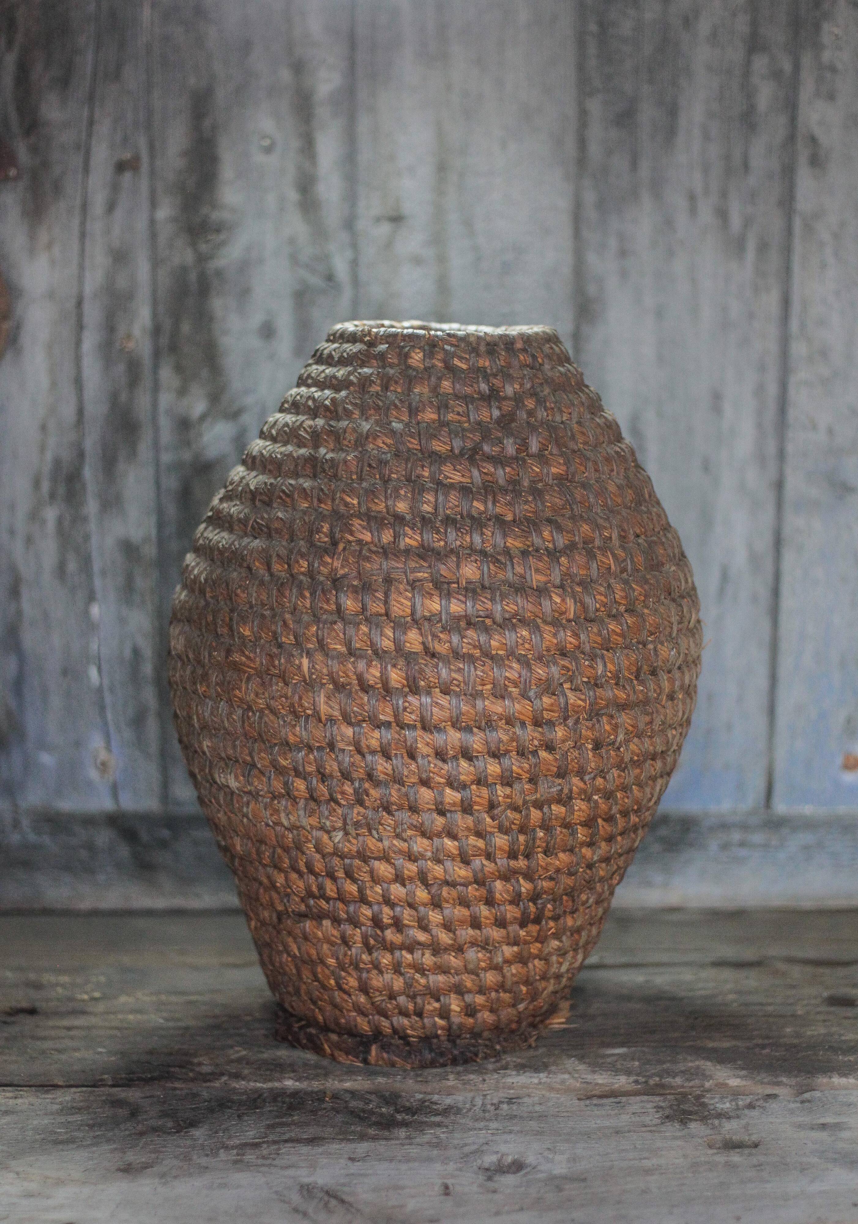Old basket, straw and bramble bourgne, woven basket, interior decoration.