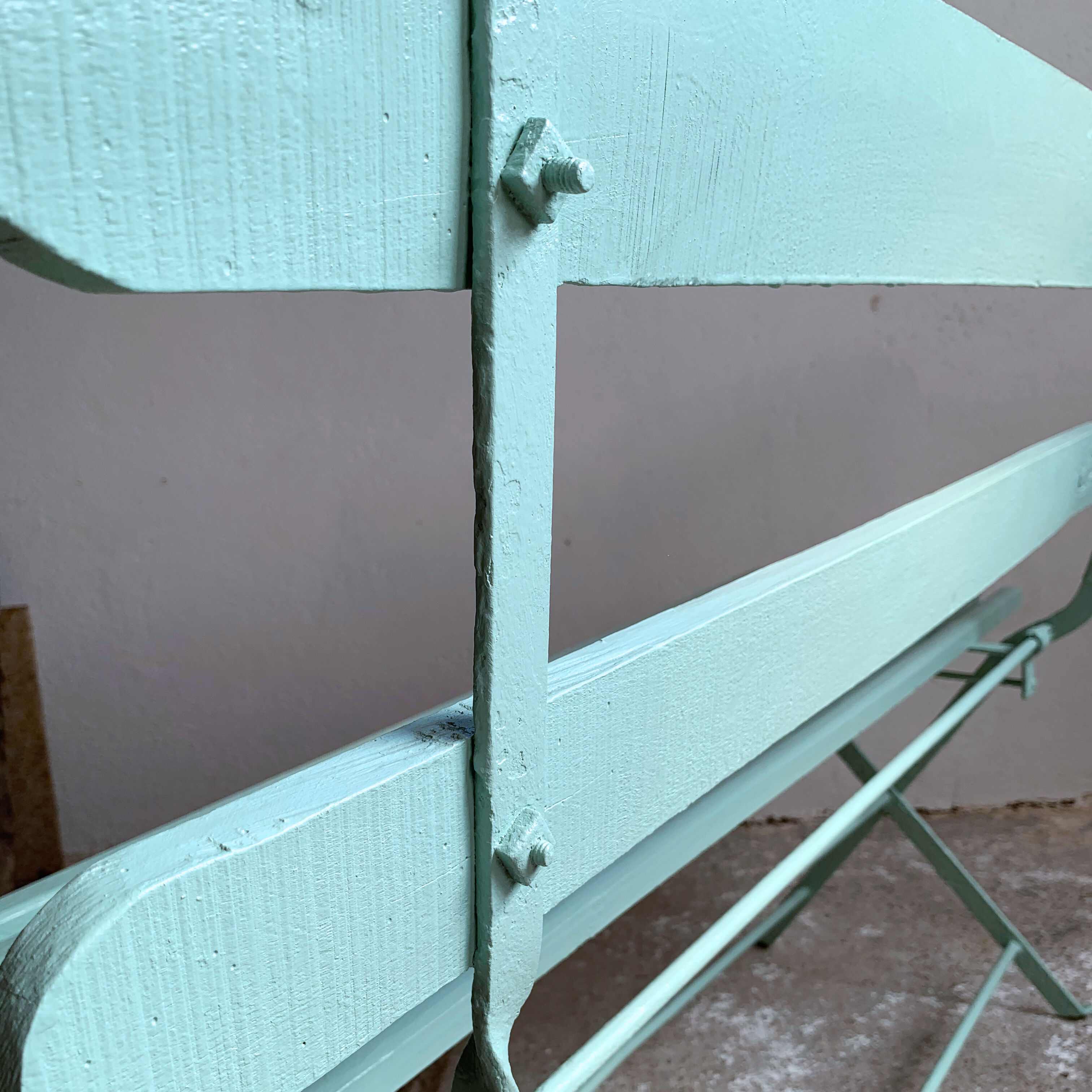 Former folding garden bench with wooden and metal slats