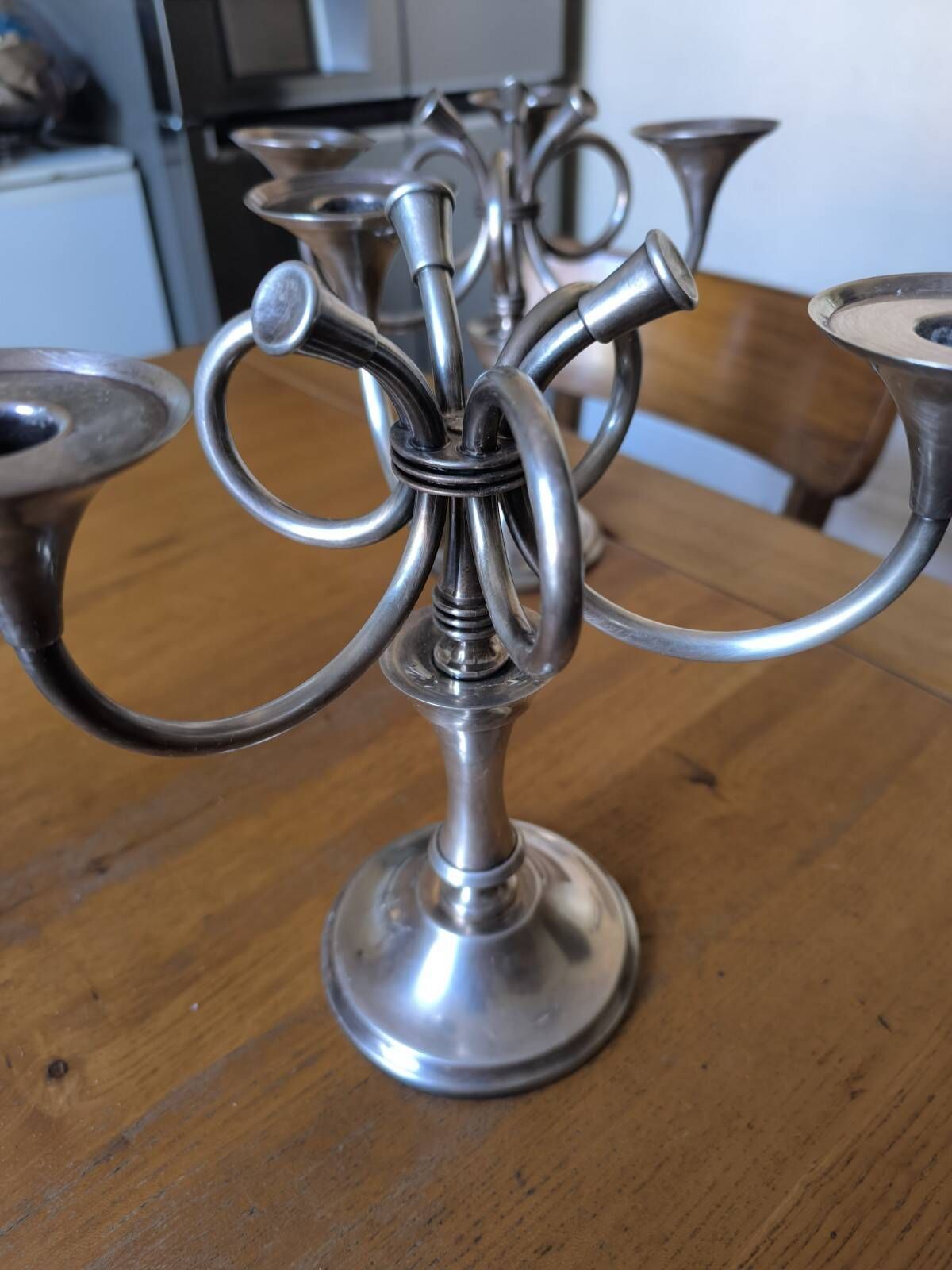 Ercuis pair of candlesticks model Cheverny in silver-plated metal with hunting horn decoration.