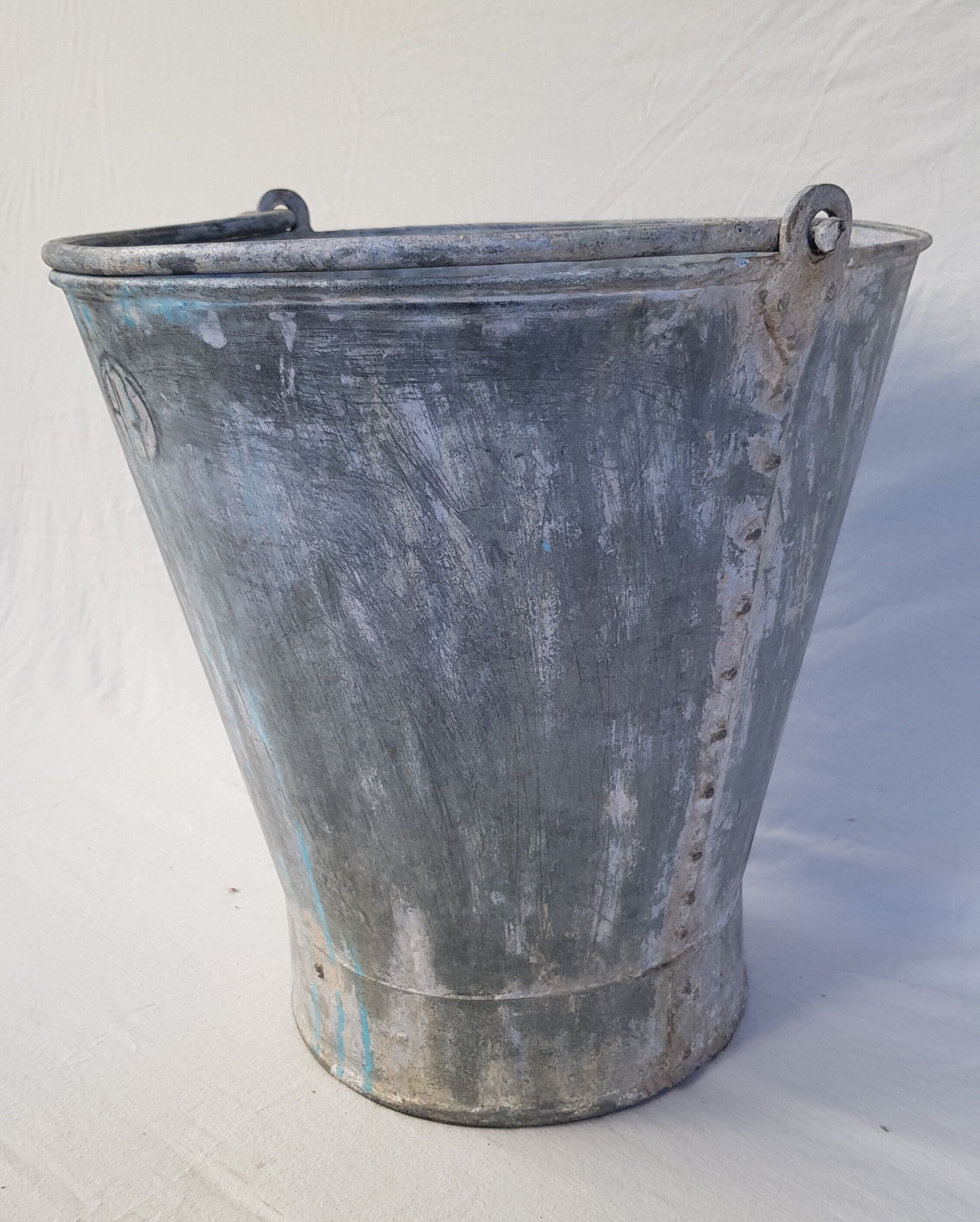 Old bucket with thick zinc handle