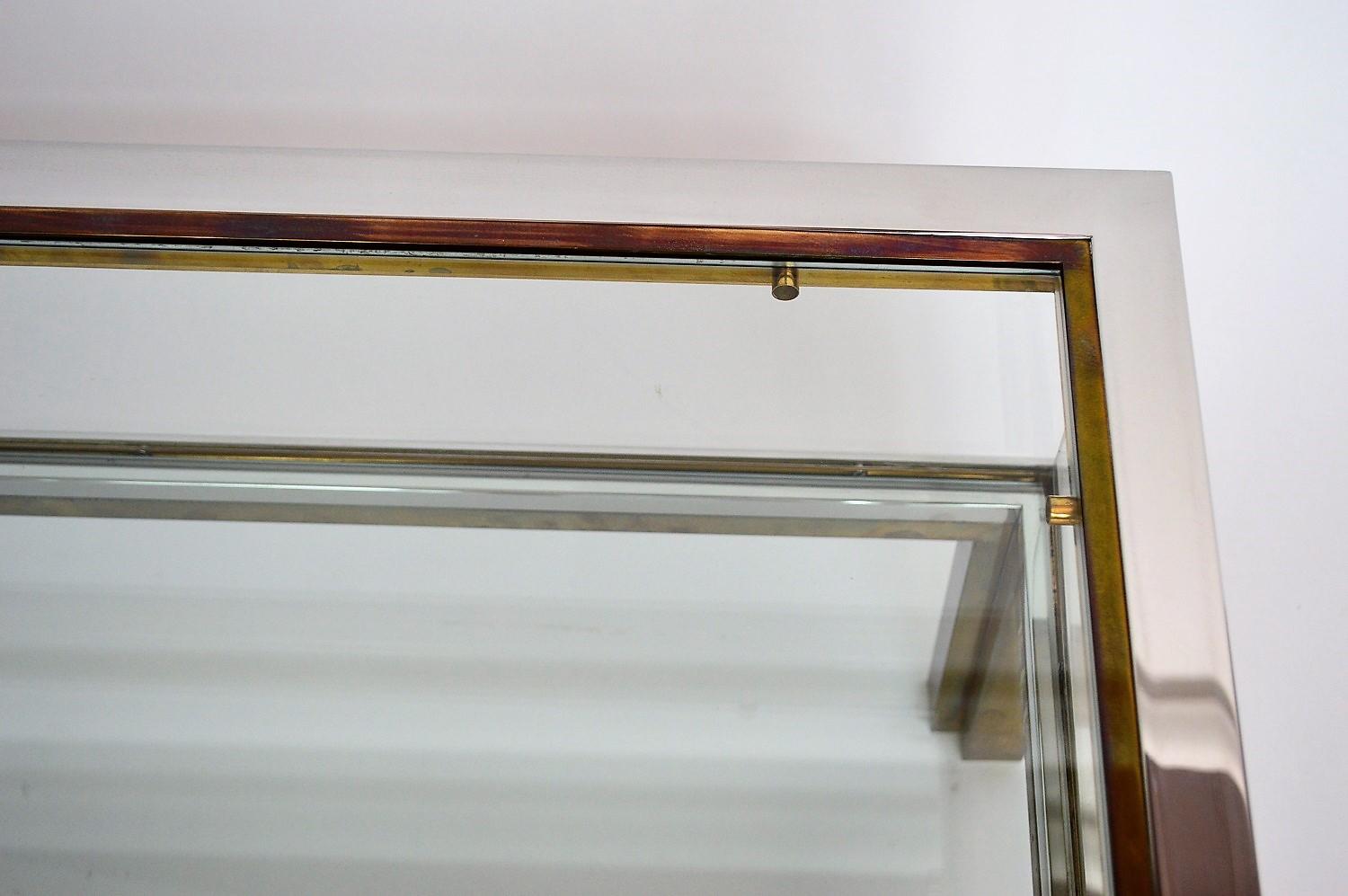 Coffee table in brass and chrome with folding top compartment to House Jansen 1970 s