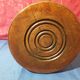 Wooden milking stool with twisted legs