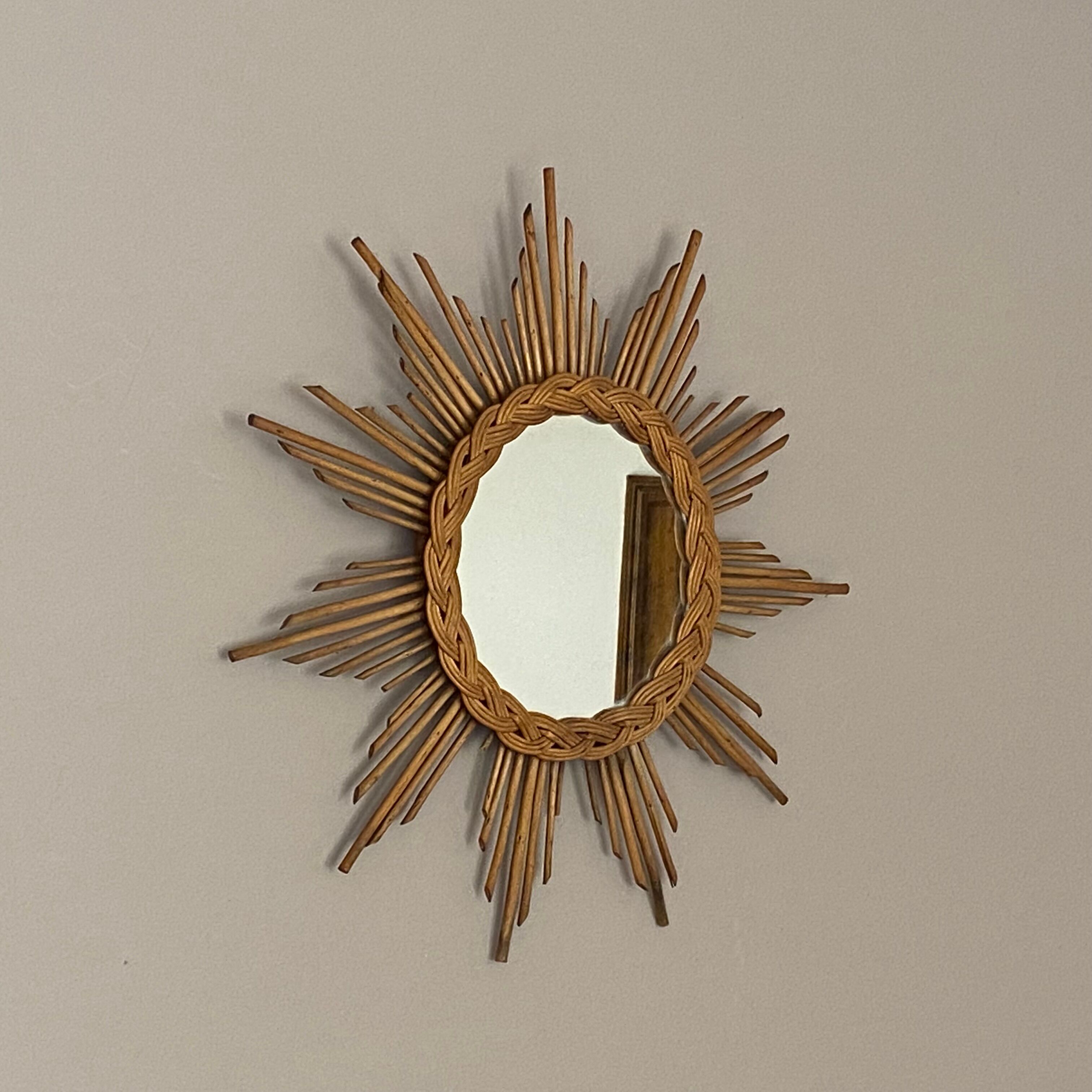 Sun mirror in braided rattan. 1960. 50cm.