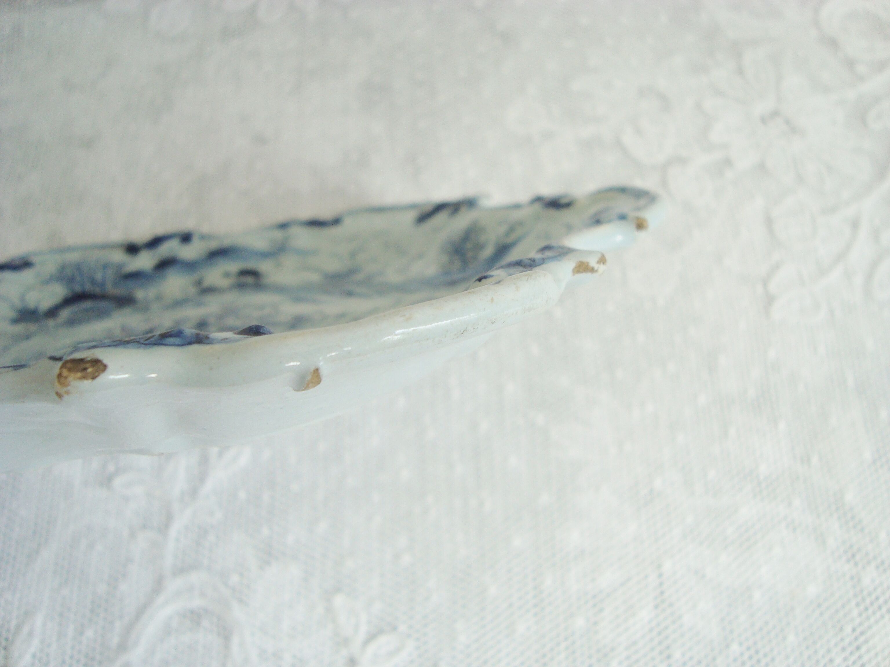 Old blue and white Delft decorative plate with Chinese motifs