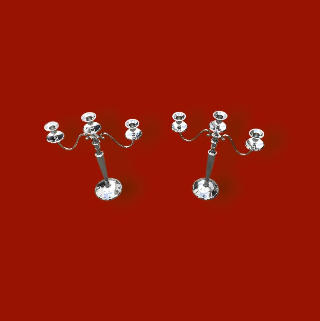 Pair of vintage three-armed chrome metal candlesticks