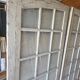 Two pairs of solid oak doors with small panes.