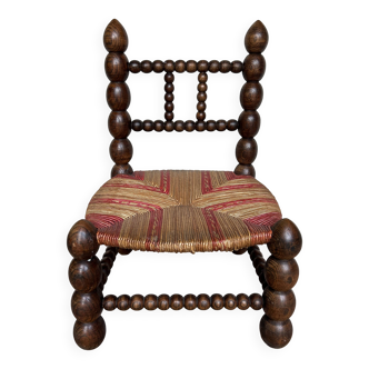 Turned wooden chair by Charles Dudouyt