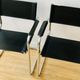 Pair of tubular armchairs in metal and leather Style Marcel Breuer