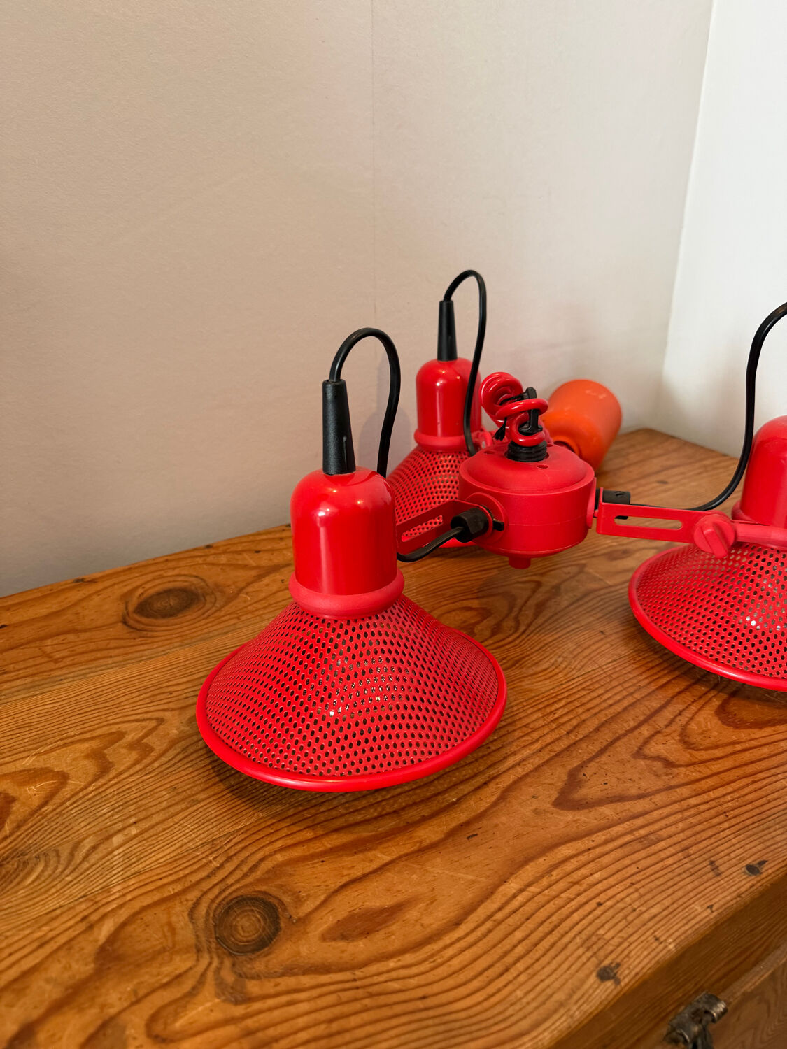 Three-lamp suspension in Memphis design style in red metal.