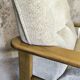 Fauteuil vintage en bois et laine