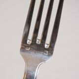 Silver plated metal service: 12 soup spoons, 12 forks and ladle.