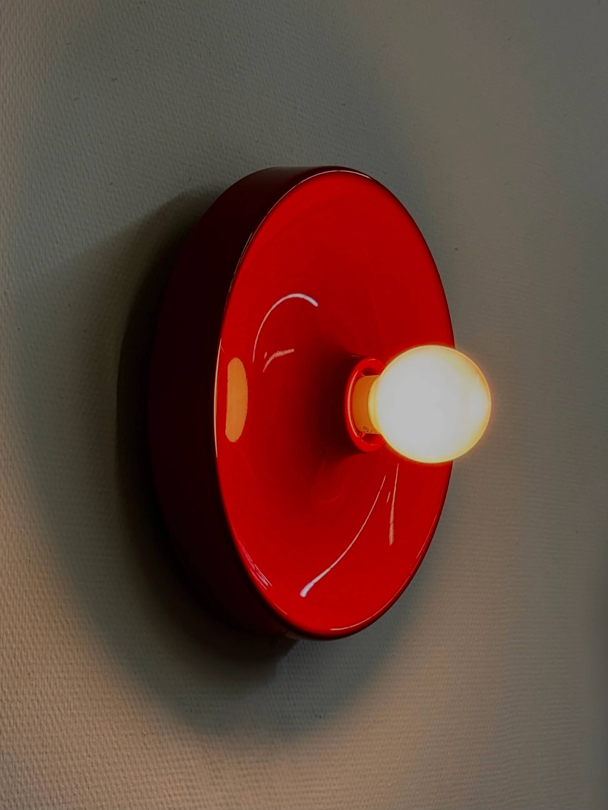 Red space age disc lamp by Enrico Tronconi