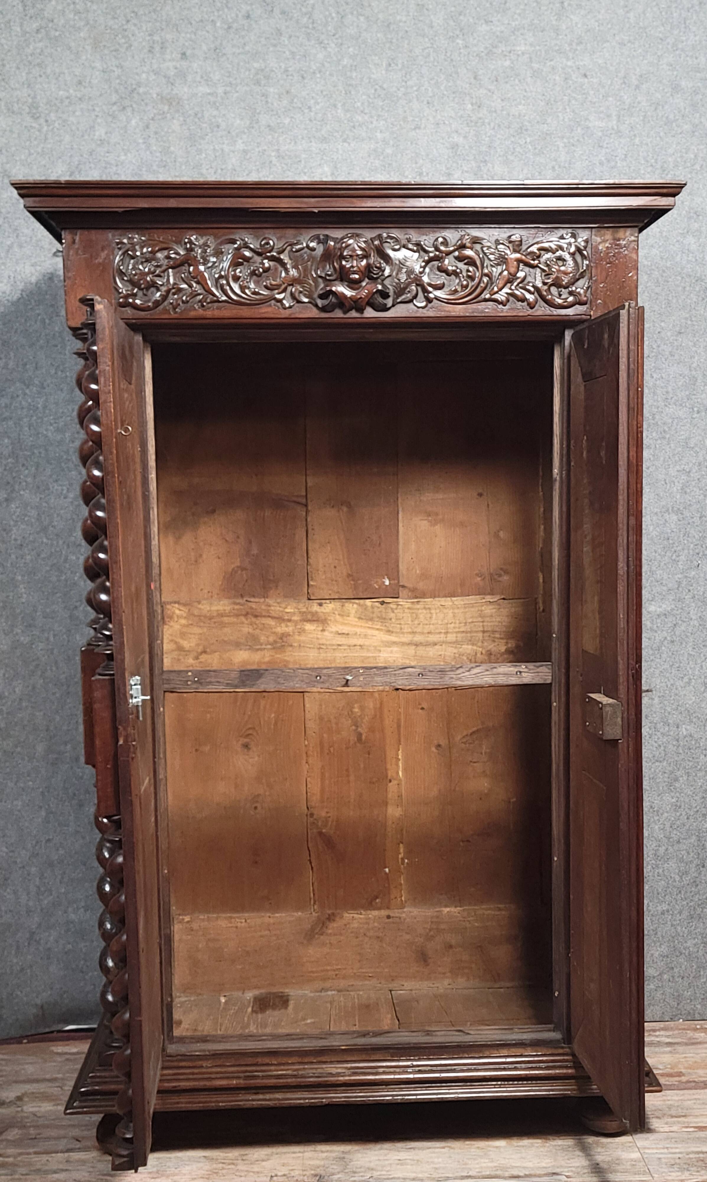 Renaissance style wardrobe in richly carved solid wood, 17th century