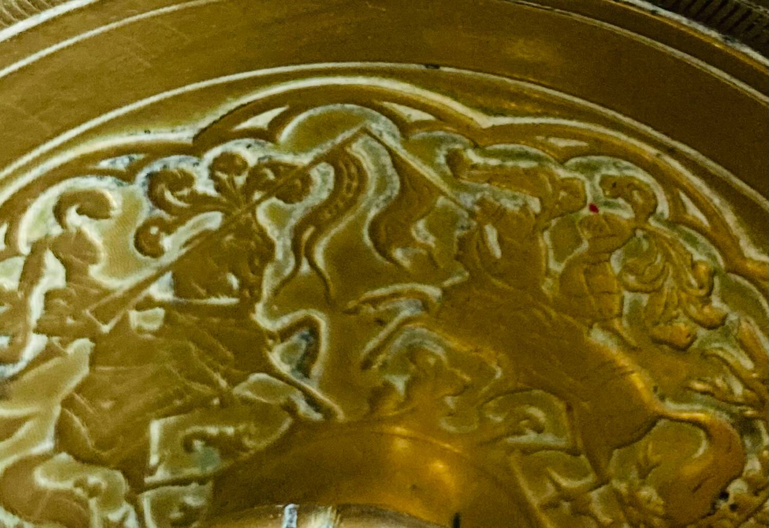 20th century chiseled brass socket candle holder representing Horsemen in armor