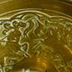 20th century chiseled brass socket candle holder representing Horsemen in armor