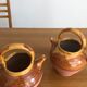 Paire d’arrosoirs vintage terre cuite