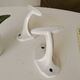 Antique Art Deco wall coat hook in enamelled cast iron.