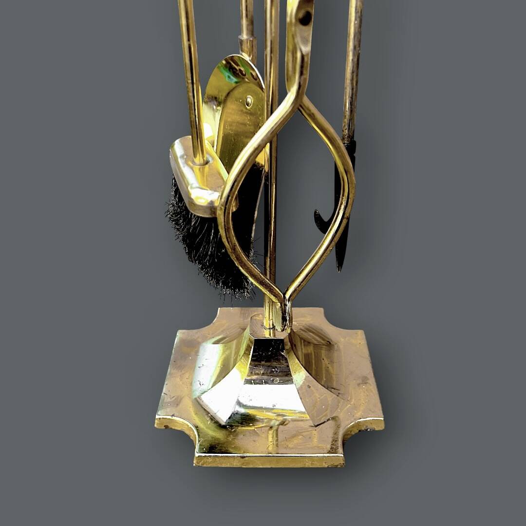 Antique fireplace tool in gilded zamak with duck head designs.