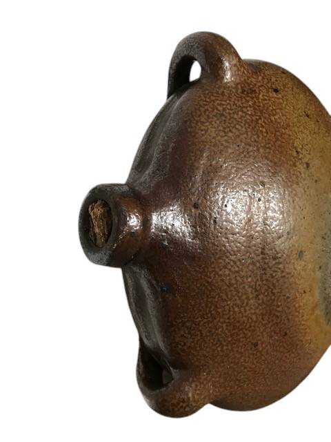 Old stoneware flask known as a toad from the 19th century.