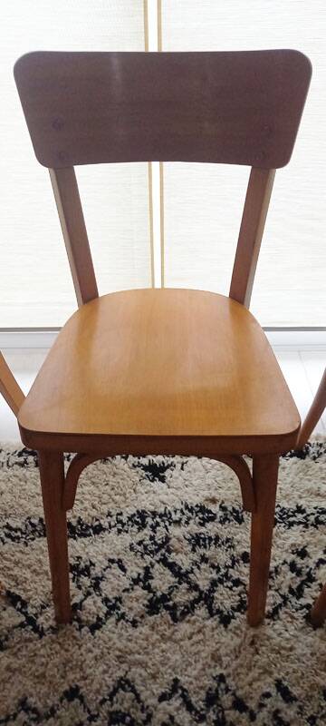 Set of 4 light wood bistro chairs stamped Baumann and Thonet.