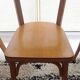 Set of 4 light wood bistro chairs stamped Baumann and Thonet.