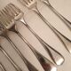10 mismatched silver metal forks