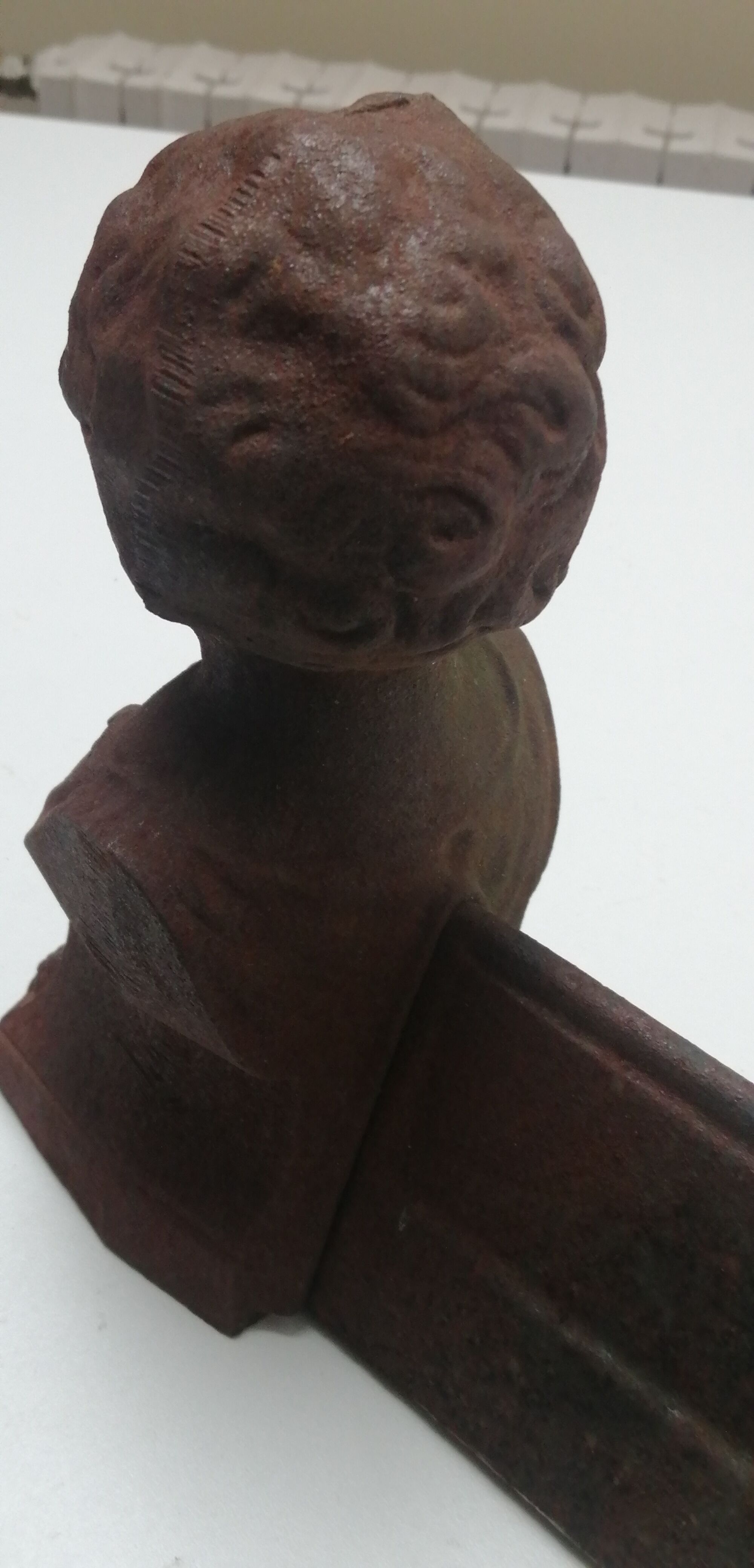 Pair of cast iron fireplace chenets "children"