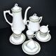 Vintage Limoges coffee service with pink and green floral decoration, coffee pot, sugar bowl, and 6 cups.