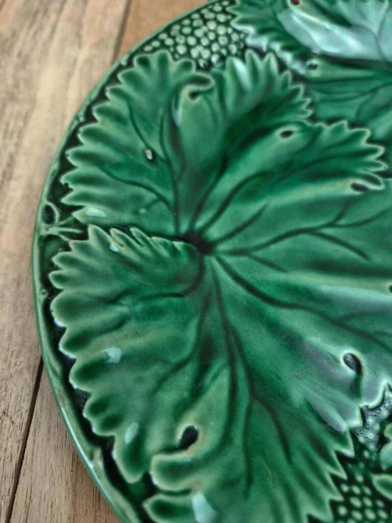 Set of 2 green earthenware dessert plates with vine decoration.