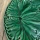Set of 2 green earthenware dessert plates with vine decoration.