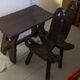Brutalist living room that consists of 2 chairs and a vintage coffee table 60s