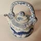 Old Chinese blue and white teapot in vintage ceramic with dragon decor